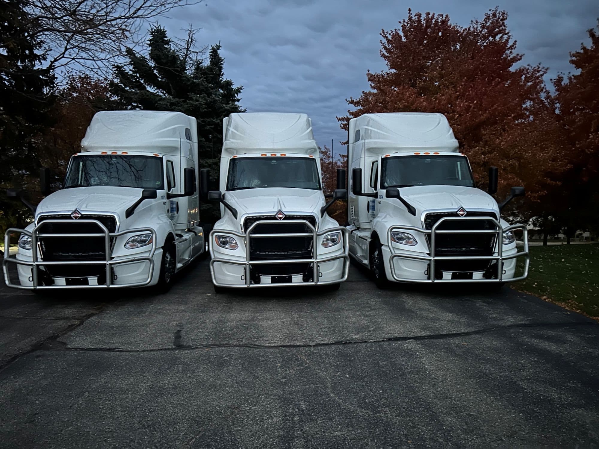 Three C & E Logistics sleeper cabs parked nose-out at the Kentwood yard.